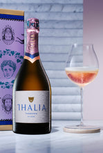 Load image into Gallery viewer, Bottle and glass of Thalia sparkling Rose wine next to purple gift box
